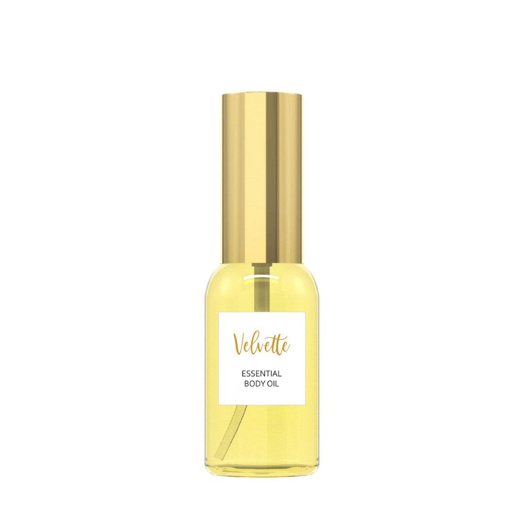 Essential Body Oil bottle with gold cap, featuring organic jojoba and lemongrass oils.