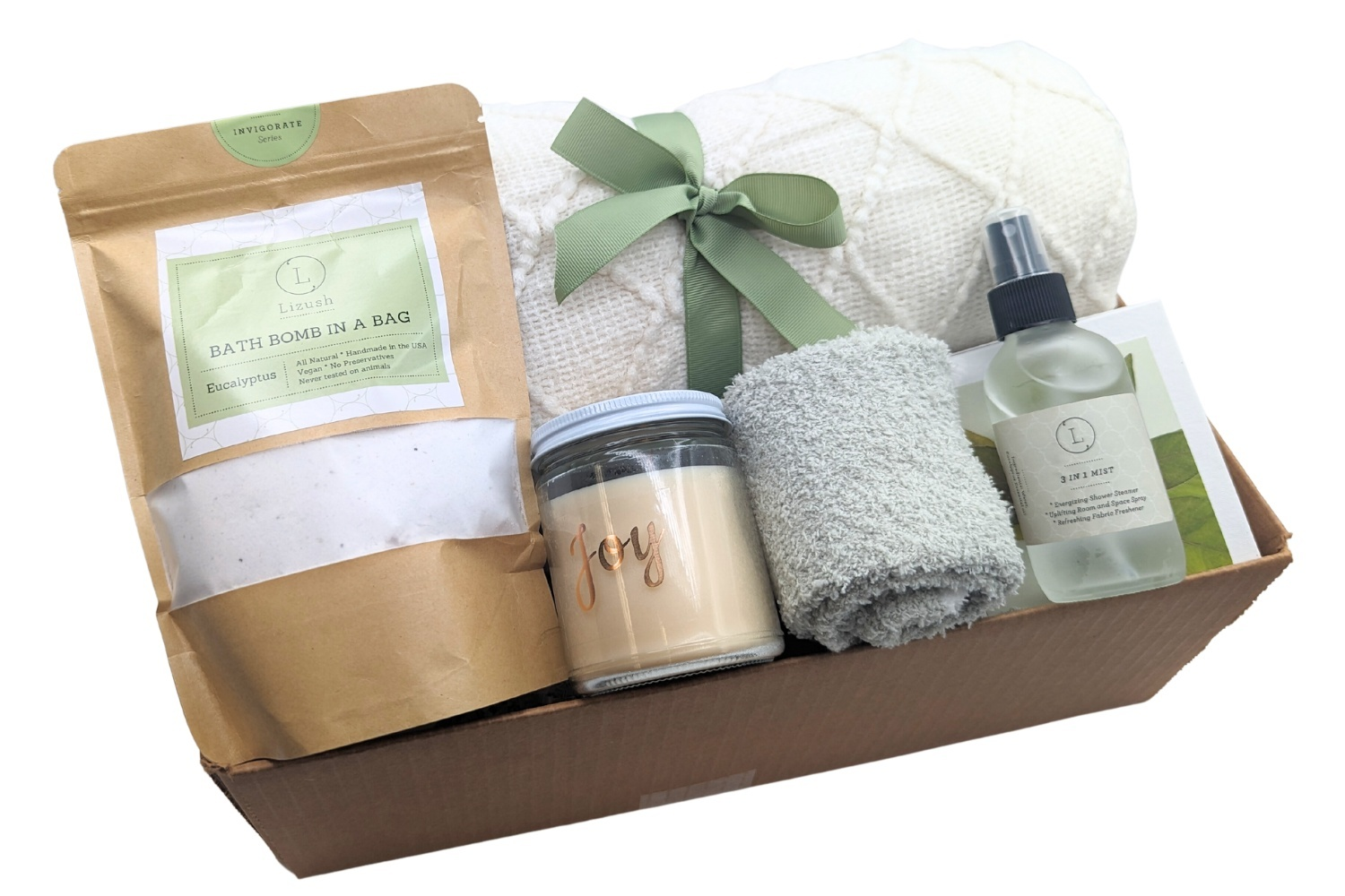 Relaxation Gift Set with blanket, soy candle, shower mist, fluffy socks, bath fizz, and gift box.