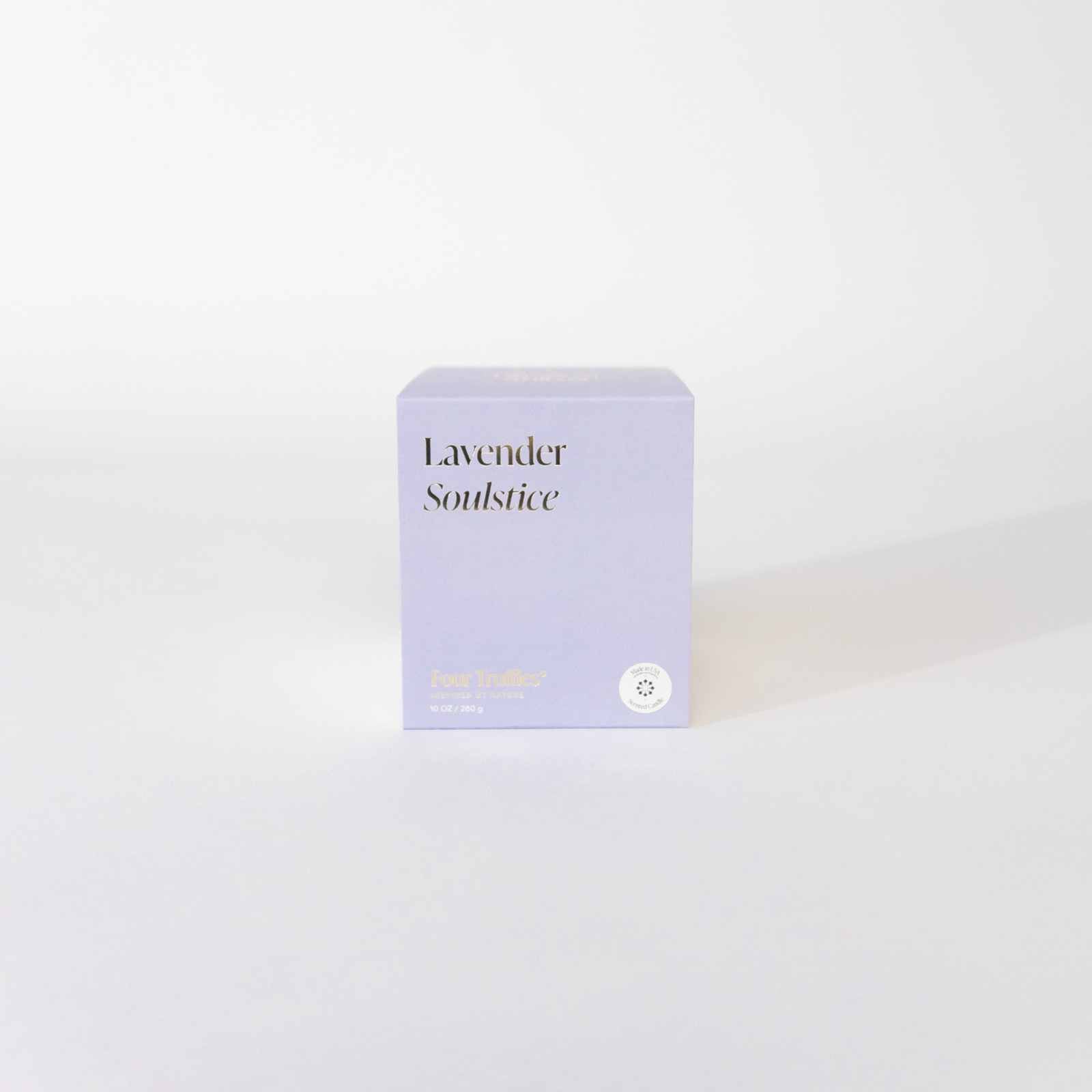 Lavender Candle in lavender packaging, uplifting citrus-forward floral fragrance.