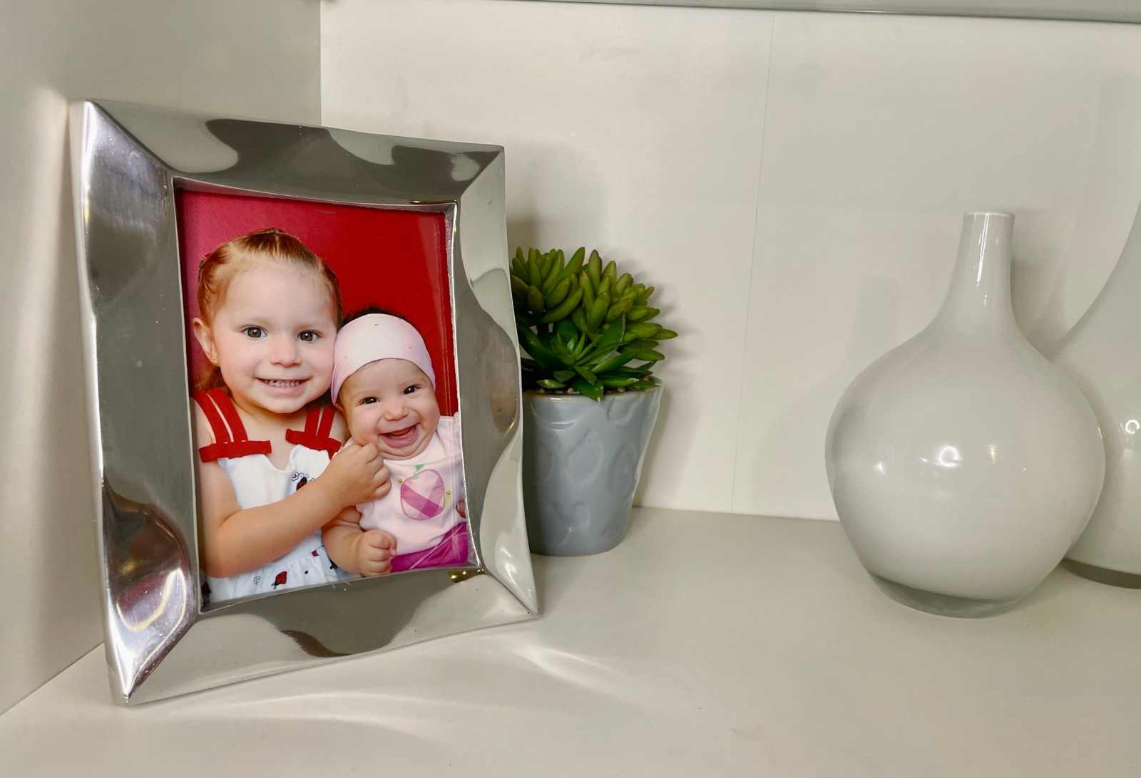 Handcrafted Aluminum Picture Frame Stylish tabletop picture frame showcasing a photo, crafted from recycled aluminum with a minimalist design.