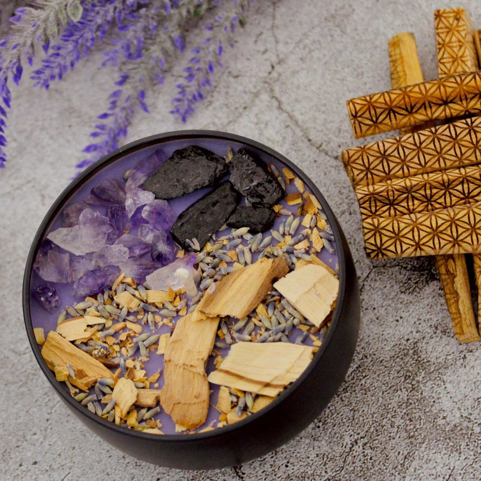 Energy Cleansing Candle with amethyst, black tourmaline, and palo santo for peace and protection.