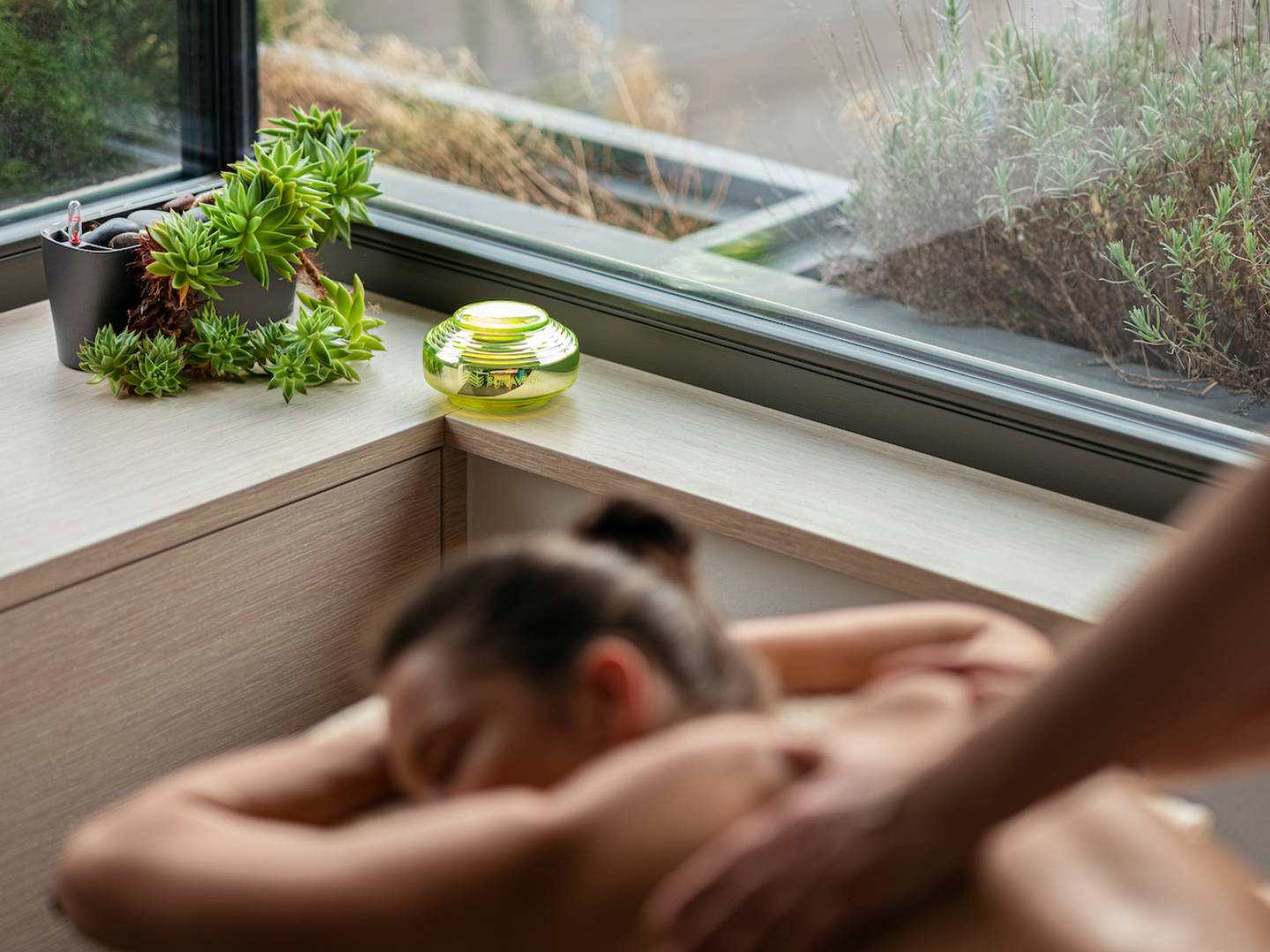 Silver-plated VEDIC Somatic Solution in relaxing spa setting with plants, enhancing space harmony.