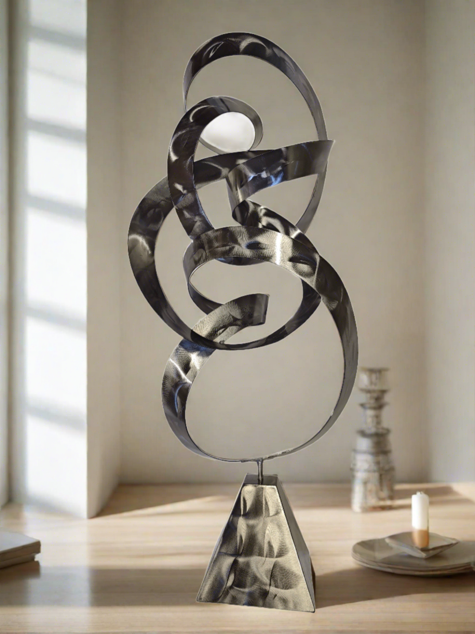 Infinite Path Metal Sculpture with a swirling abstract design in polished stainless steel, symbolizing fluidity and mindfulness, perfect for modern and meditation spaces.