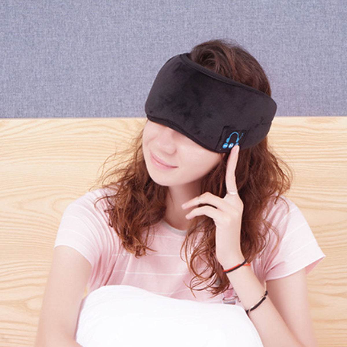 Bluetooth Sleep Mask worn by a woman, offering relaxation and music with high-fidelity sound, ideal for sleep and travel.