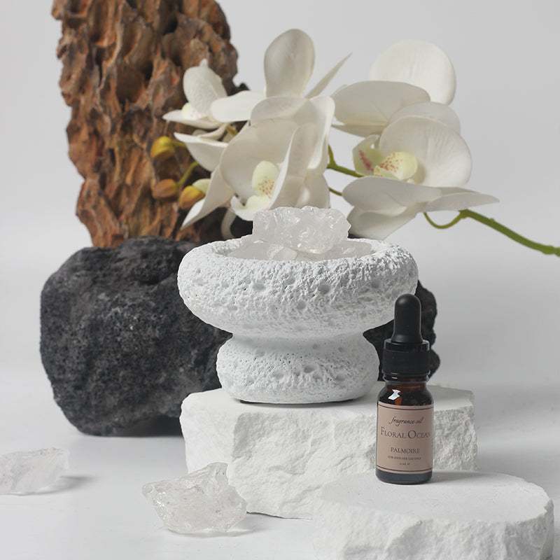 White Moon Diffuser with Floral Ocean fragrance bottle and serene decor.