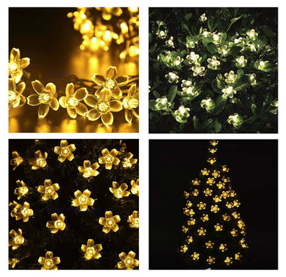 Cherry Blossom Solar LED String Lights in warm yellow illuminating outdoors at night.