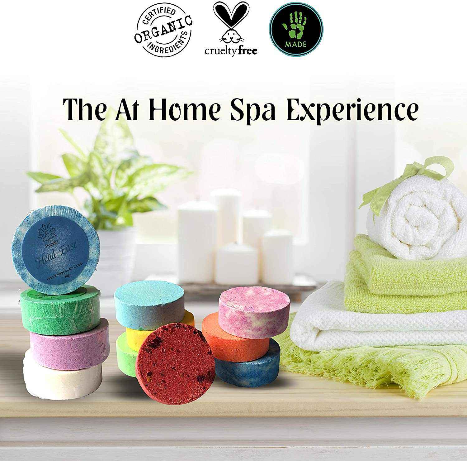 Natural and Organic Shower Bomb Set with essential oils displayed in an at-home spa setting, featuring vibrant steamers and cozy towels.