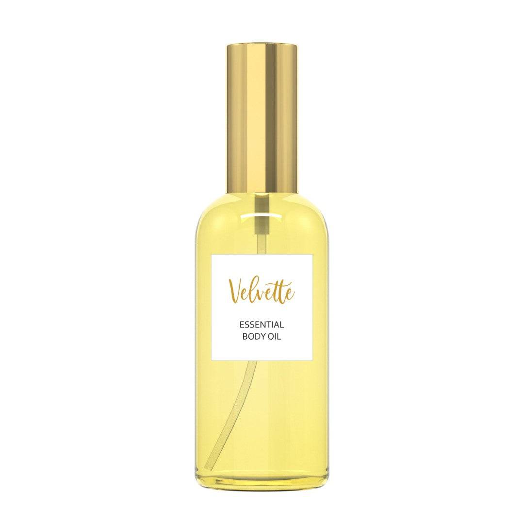 Velvette Essential Body Oil bottle with jojoba and lemongrass for skin hydration.