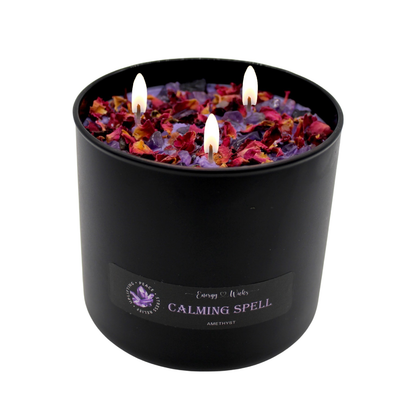 Calming Spell Candle with amethyst, black container, soothing white tea fragrance.