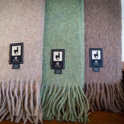 Alpaca wool throw blanket in solid colors with fringe, made in Peru.