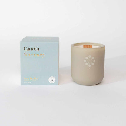 Canyon Sanctuary Candle with calming jasmine, rosewood, and violet fragrance in a serene design.