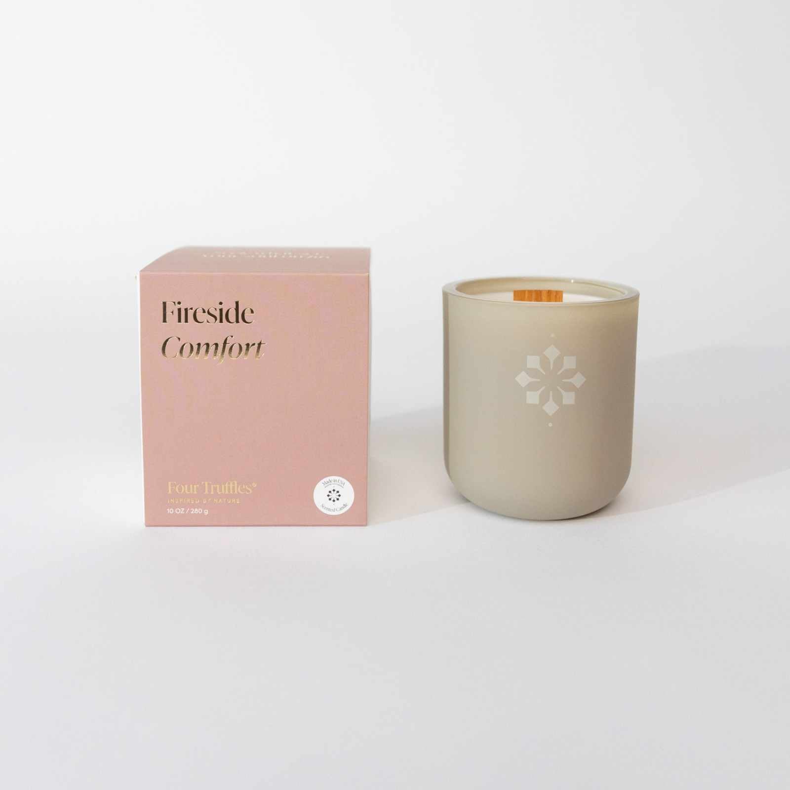 Fireside Comfort Candle with box, evoking a warm and cozy atmosphere through smokey, earthy, and citrus scents.