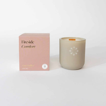 Fireside Comfort Candle with box, evoking a warm and cozy atmosphere through smokey, earthy, and citrus scents.