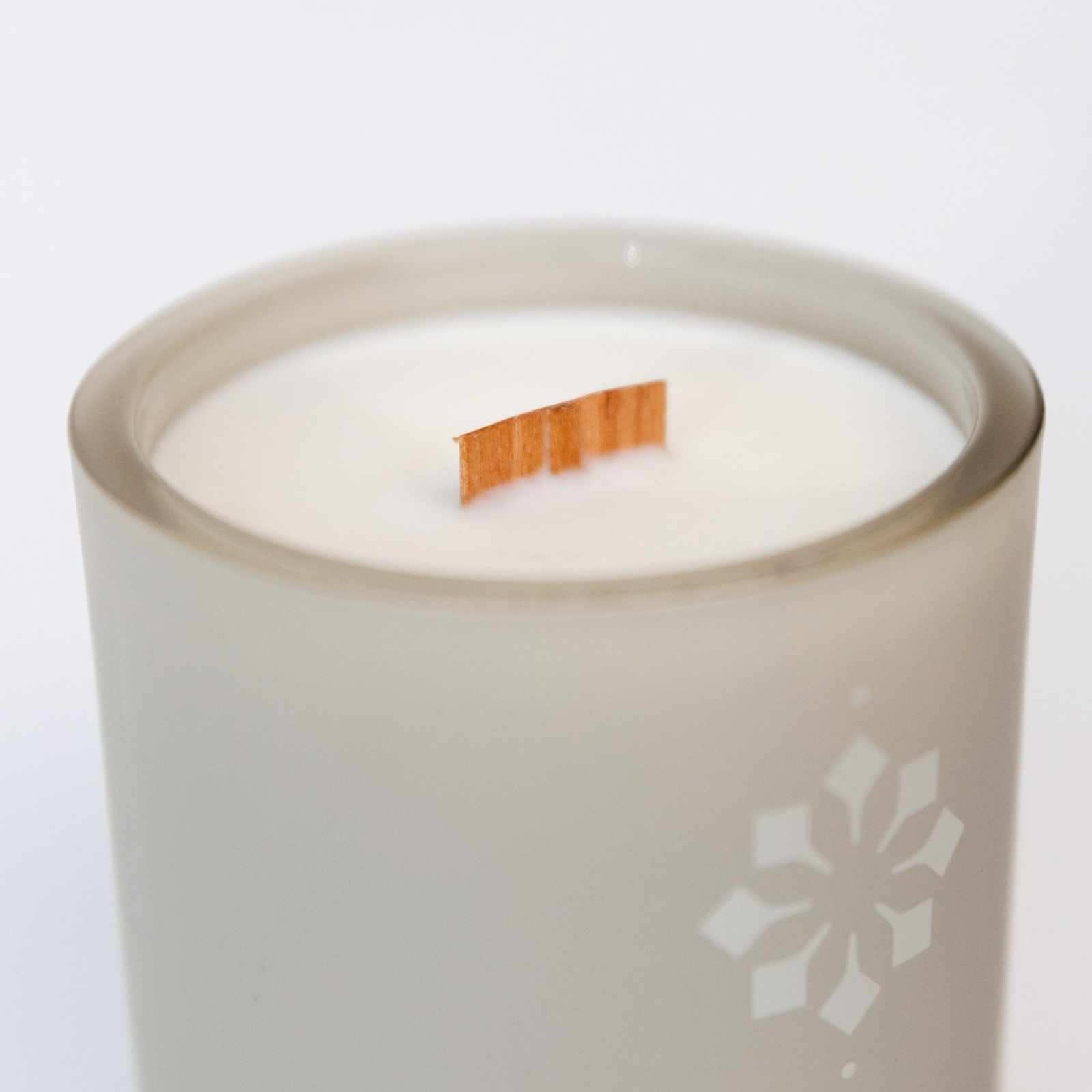 Lavender Soulstice Candle in a frosted glass jar with a wooden wick.