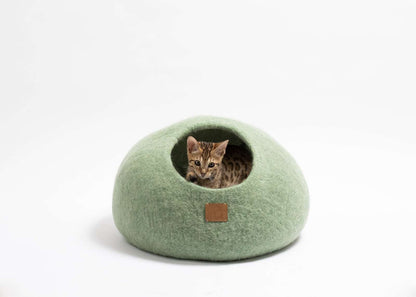 Eucalyptus Green Cat Cave made of felted merino wool with kitten inside.