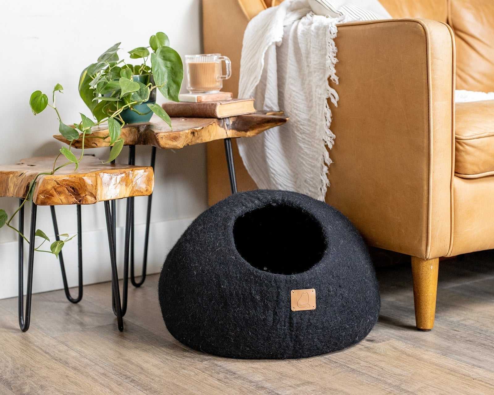 Round style felted wool cat cave bed in night black.