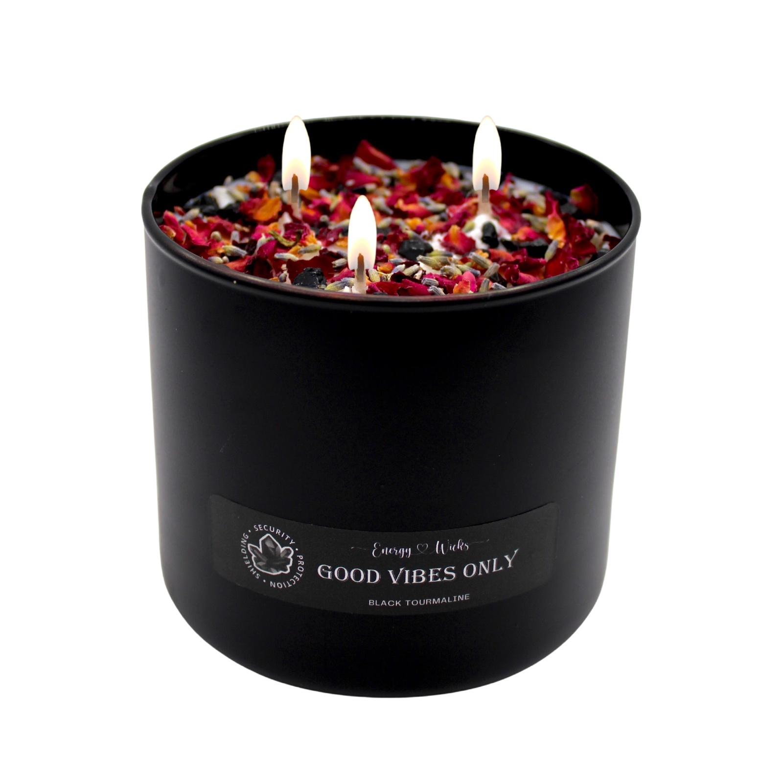 Black candle with three wicks, adorned with colorful petals, labeled "Good Vibes Only," featuring Black Tourmaline crystals for peace and positivity.