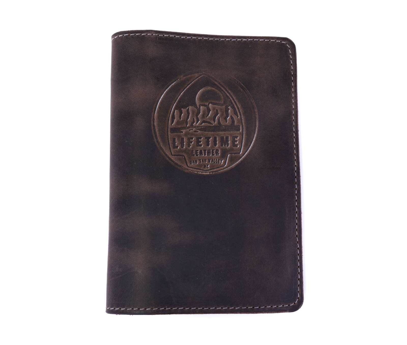 Handcrafted leather journal with embossed design, featuring full-grain American leather and minimalist style.