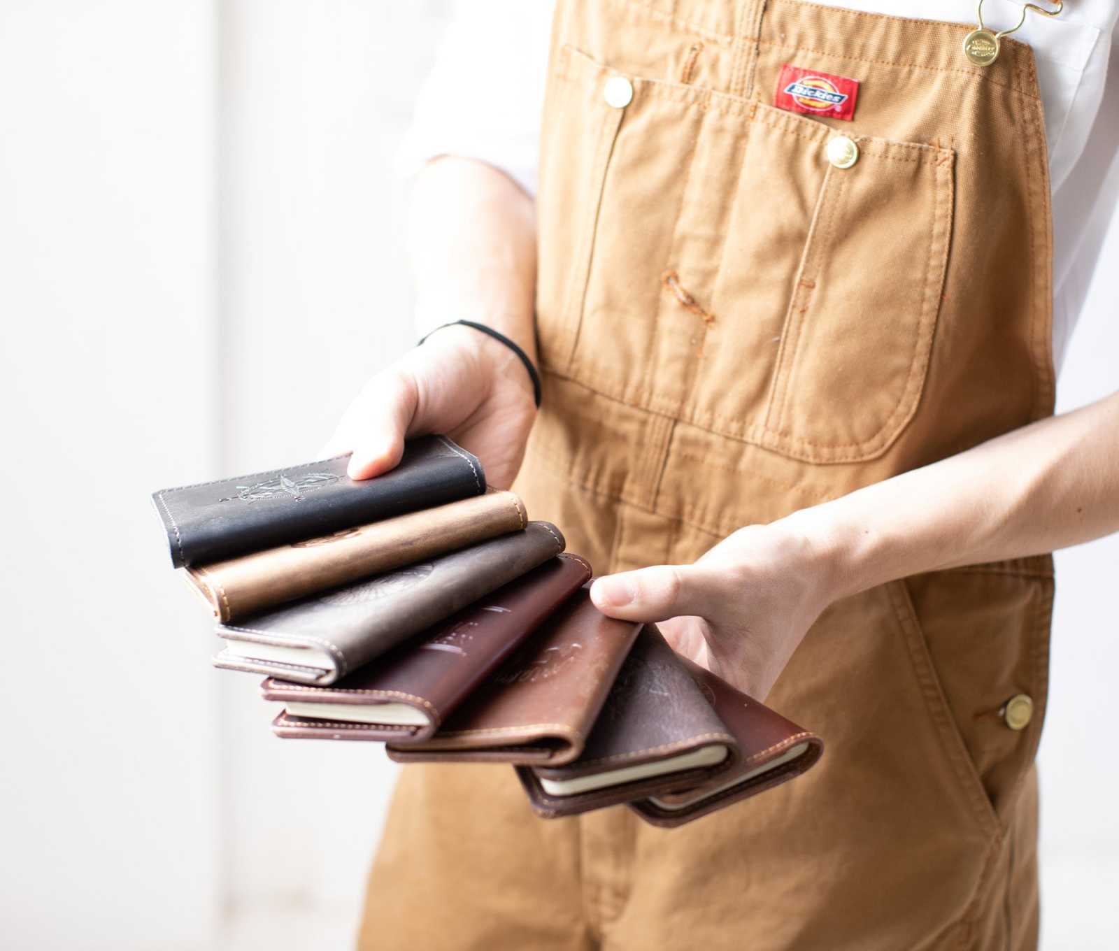 Handcrafted mini journals made from full-grain leather in various colors, perfect for quick notes.