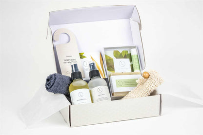 Body Skincare Gift Box with massage oil, eucalyptus mist, natural soap, and lip balm, in customizable packaging.