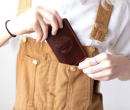 Handcrafted leather mini journal fitting into pocket.