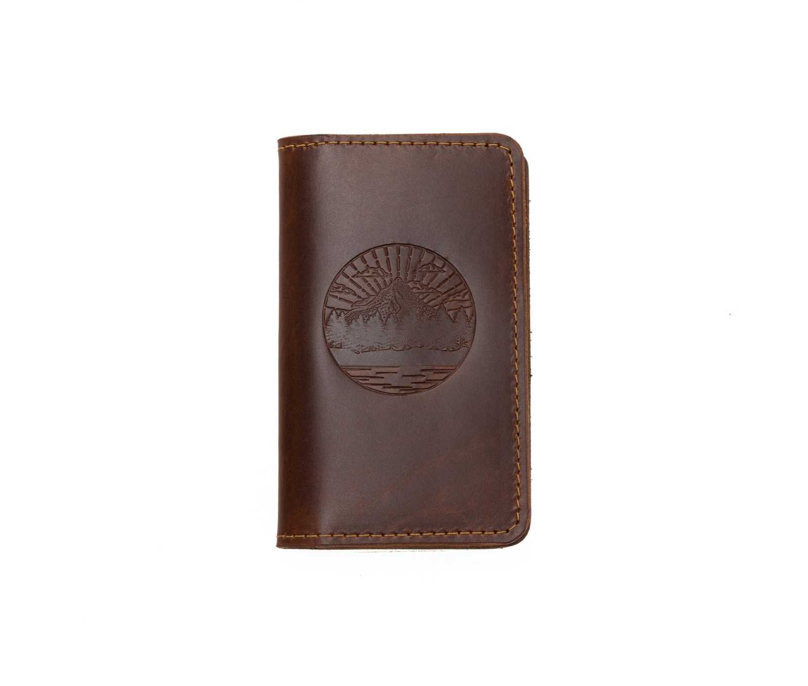 Handcrafted full-grain leather mini journal with embossed design, sewn edges, and card slot.