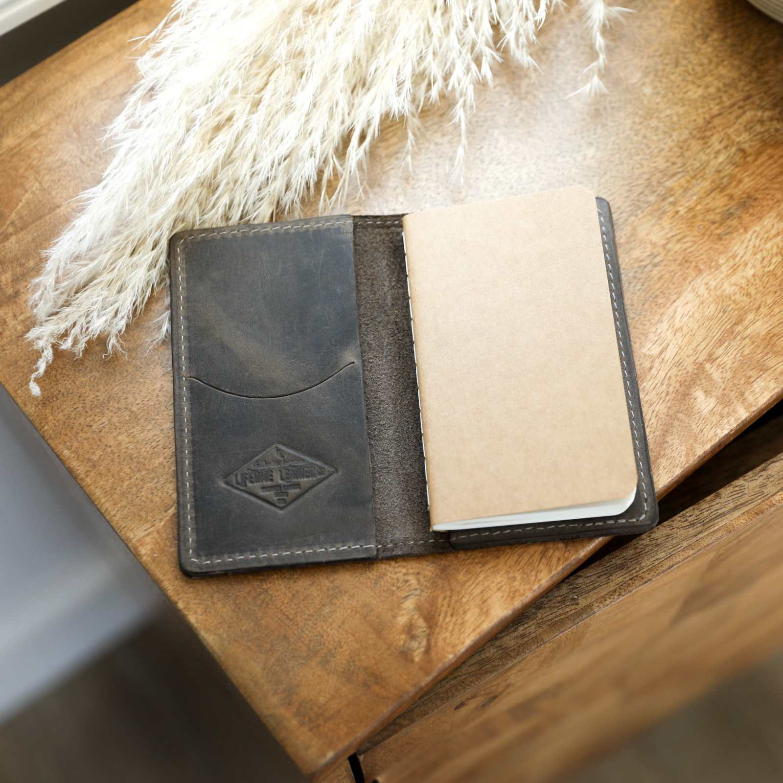 Handcrafted full-grain leather mini journal with sewn edges and card slot, 3.25"x5.25".