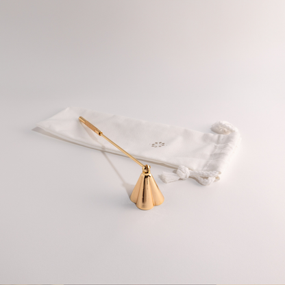 Candle snuffer and wick trimmer duo with elegant design.