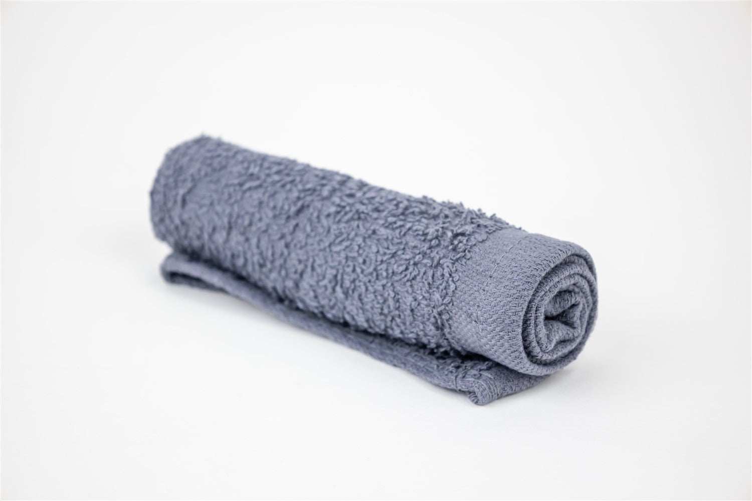 Gray rolled face towel from Bath and Body Skincare Gift Box set.