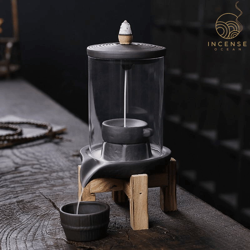 Mystical waterfall incense burner with cascading smoke effect, minimalist design, and transformative scents. Ideal for meditation and relaxation.