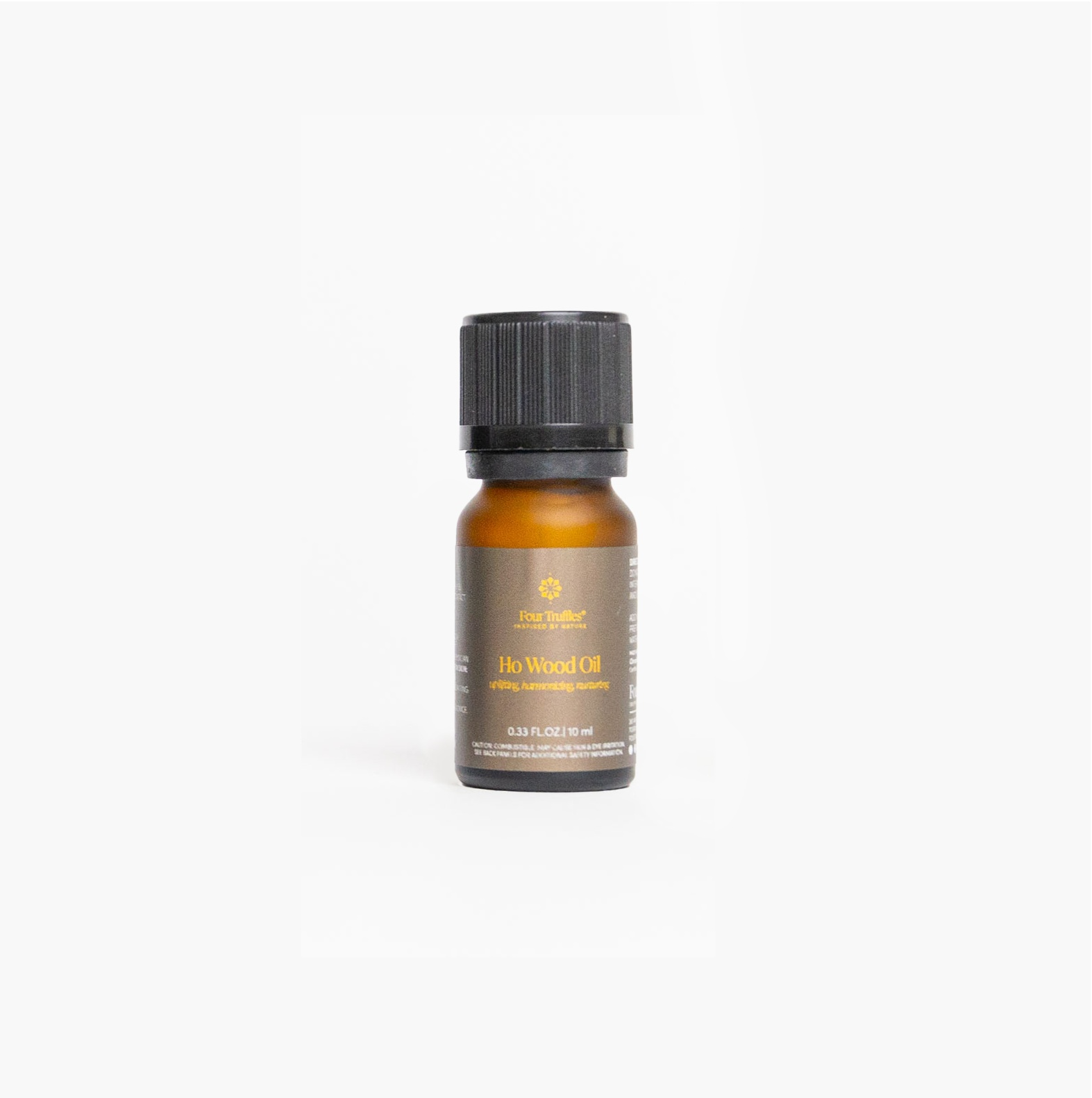 Brown bottle of "Ho Wood Essential Oil" with a black cap, promoting mood elevation and relaxation.