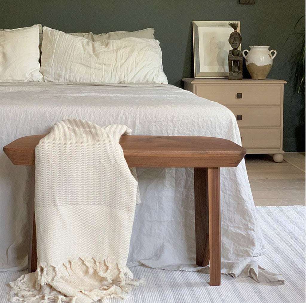 Handwoven Turkish Throw Blanket with hand-knotted fringe on bed bench