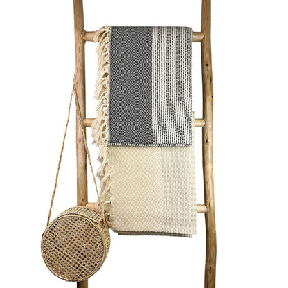 Diamond Stripe Turkish Throw with hand-knotted fringe on wooden ladder display.