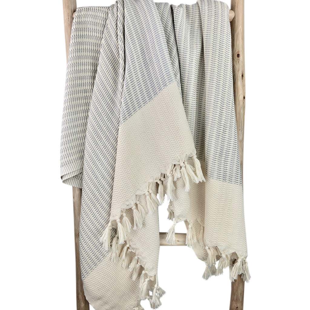 Handwoven Turkish Throw Blanket by SLATE + SALT with intricate pattern and hand-knotted fringe.